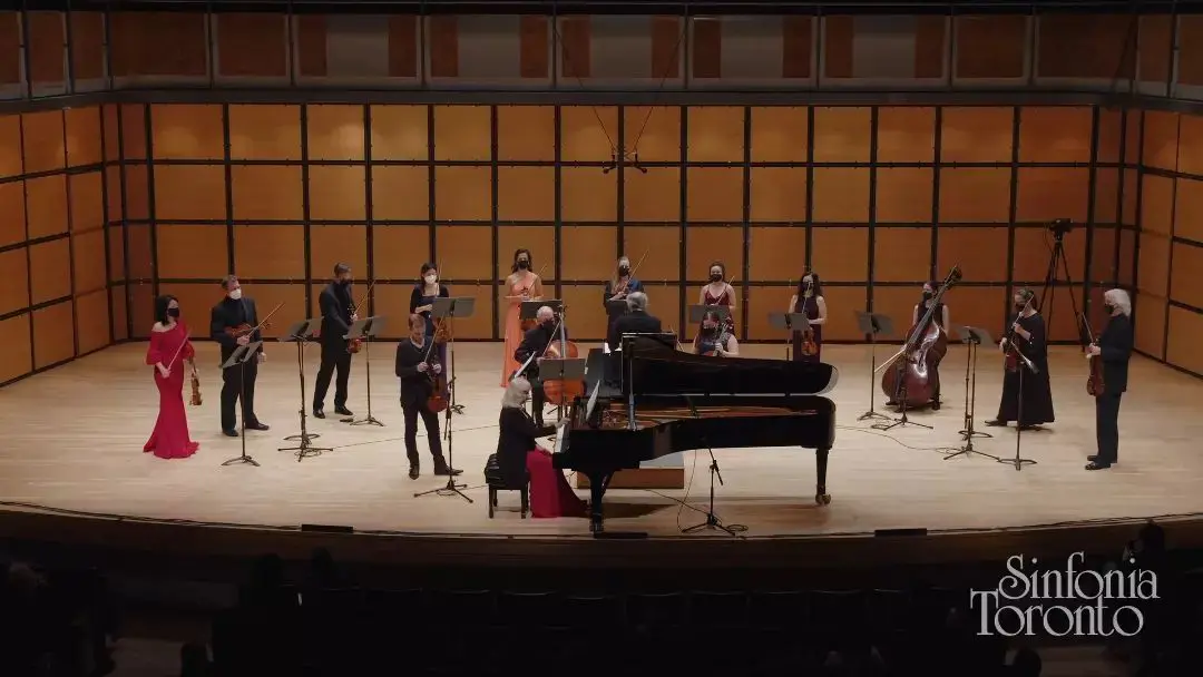 Sinfonia Toronto performance, Nurhan Arman, conductor, performing duo concertos by Larysa Kuzmenko, Alice Ping Ho, and Christos Hatzis, with violinist, Marc Djokic.
